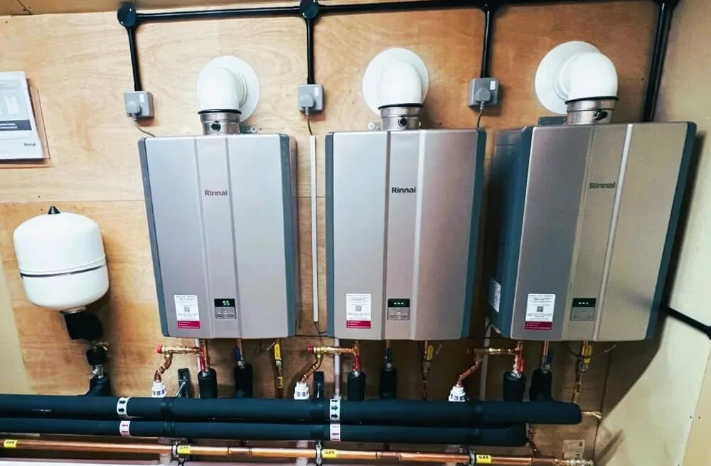 Three wall-mounted water heaters